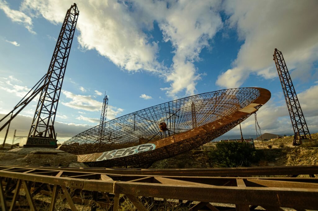 a large metal object sitting on top of a train track